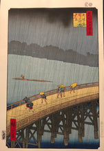 Load image into Gallery viewer, Utagawa Hiroshige, 100 Famous Views of Edo,Sudden Shower over Shin-ohashi Bridge and Atake
